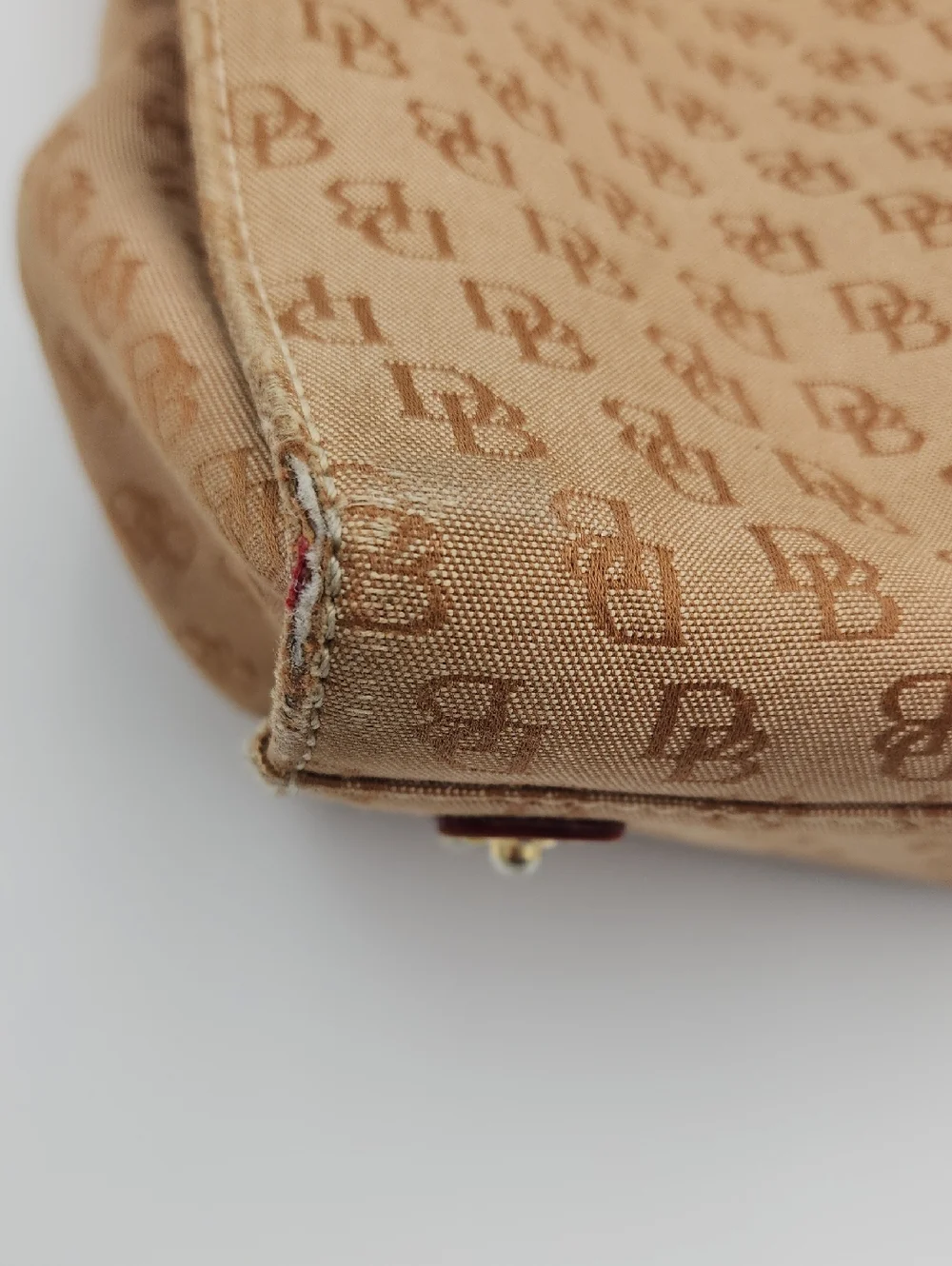 Dooney & Bourke Signature Monnogram Brown And Pink Satchel Bag‎